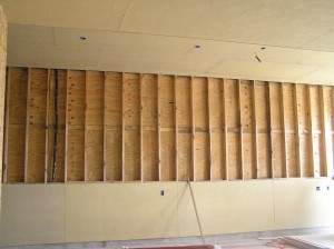 Crew installing stucco Hardie in garage