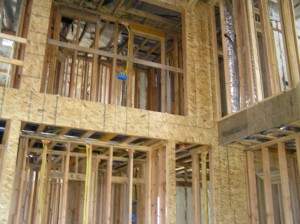 Great room looling up to bunkroom bath- Wind Storm Plywood on Shear wall, ready to sheetrock
