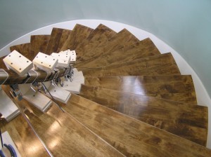 Treads installed, Banister being cured into stair curvature after water soak