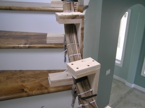 Treads installed, Banister being cured into stair curvature after water soak