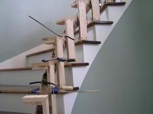 Treads installed, Banister being cured into stair curvature after water soak