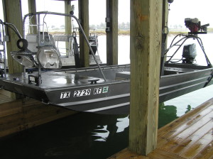Flounder Boat on boat Lift in Dock